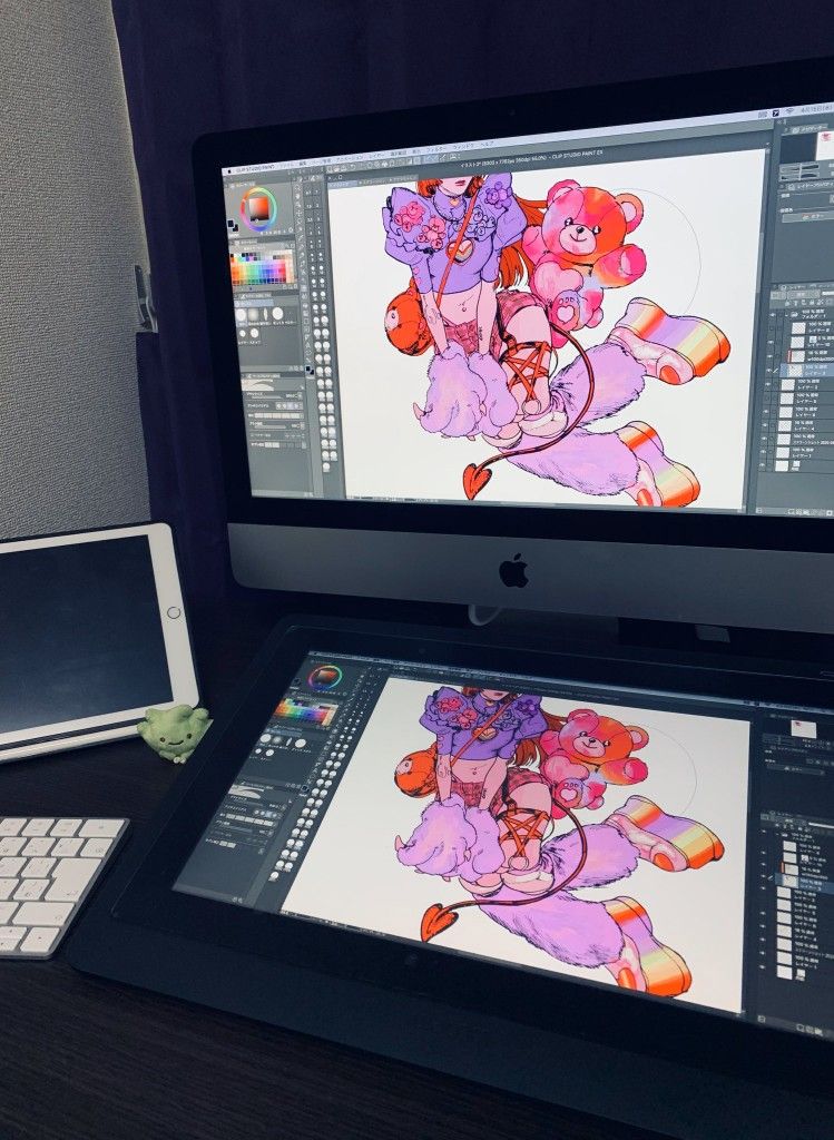 Digital artwork in progress on dual monitors, showcasing vibrant illustration of a character with pink teddy bear and colorful attire.