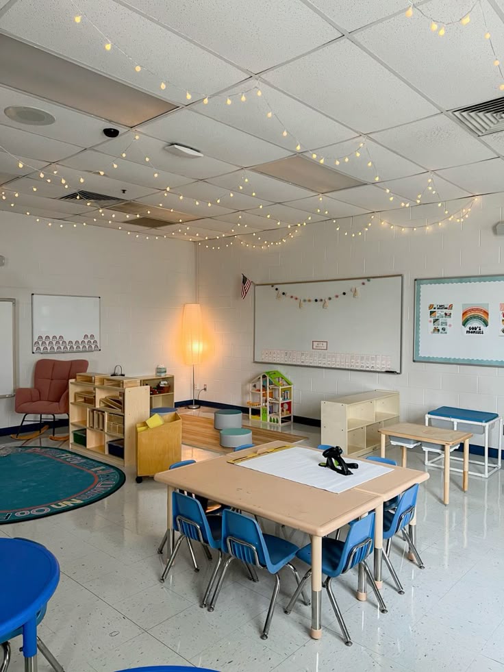 cozy pre-k classroom☁️ Cozy classroom with string lights, colorful furniture, educational toys, and organized learning spaces for young students. | Sky Rye Design Cozy classroom with string lights, colorful furniture, educational toys, and organized learning spaces for young students.