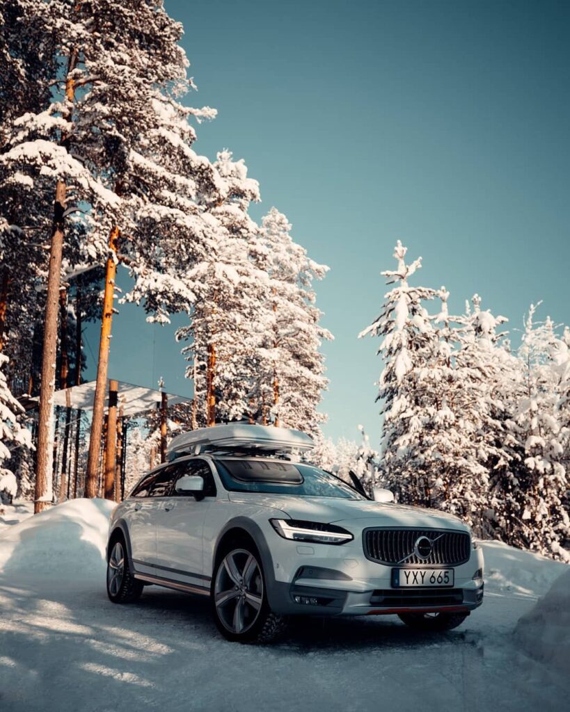 df14a1624feefdc7c48969cb6cbf148f White SUV in a snowy forest setting under a clear blue sky, showcasing winter adventure and sleek automotive design. | Sky Rye Design White SUV in a snowy forest setting under a clear blue sky, showcasing winter adventure and sleek automotive design.