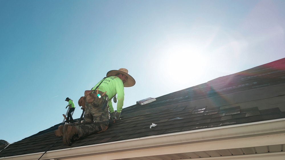 image Roofers installing shingles in bright sunlight, wearing safety gear and green shirts. | Sky Rye Design Roofers installing shingles in bright sunlight, wearing safety gear and green shirts.