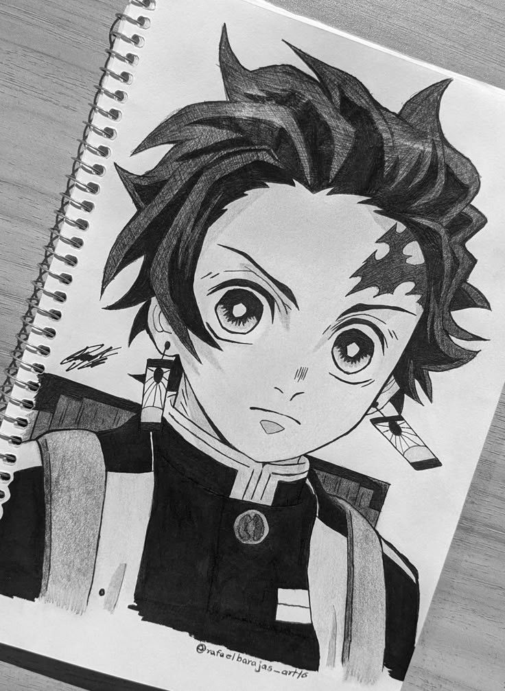 undefined 1 Black and white drawing of a character with spiky hair in a notebook. | Sky Rye Design Black and white drawing of a character with spiky hair in a notebook.