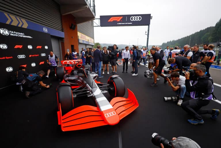 merlin_211944981_8261f1e0-a488-4867-b1a7-95b5828049da-superJumbo Photographers capture an Audi F1 car at a Formula 1 event, showcasing the sleek design and vibrant colors on display. | Sky Rye Design Photographers capture an Audi F1 car at a Formula 1 event, showcasing the sleek design and vibrant colors on display.