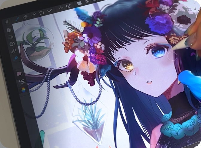 Artist creating vibrant anime character on digital device, featuring colorful floral elements and unique glowing eyes.