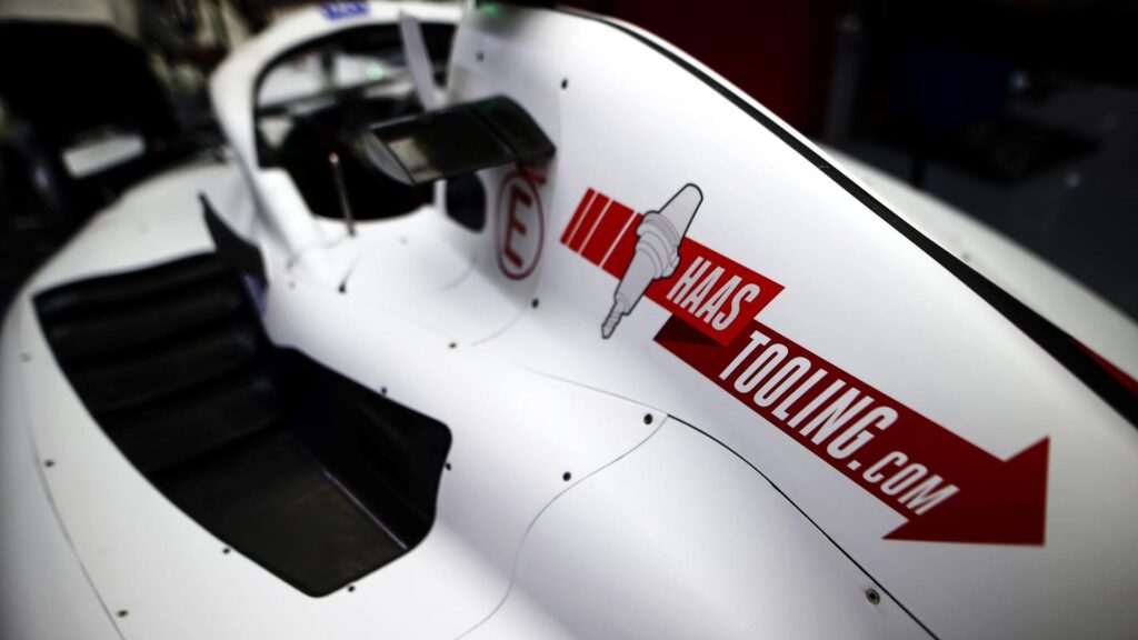 tooling_web_1 Close-up of a race car with Haas Tooling logo on side panel, showcasing sleek aerodynamic design. | Sky Rye Design Close-up of a race car with Haas Tooling logo on side panel, showcasing sleek aerodynamic design.