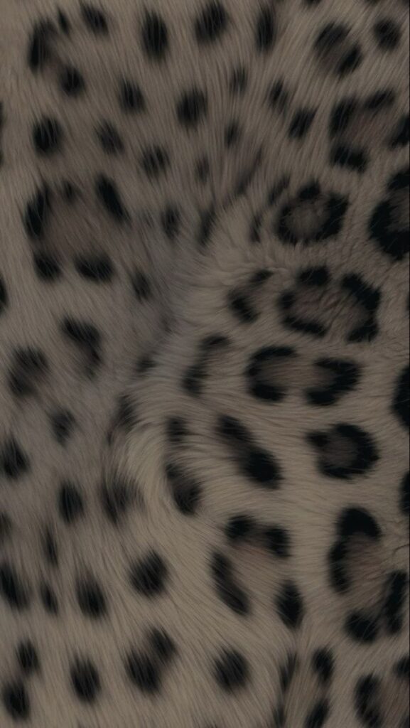 undefined 1 Close-up of leopard fur pattern, showcasing natural black spots on a tan background, highlighting texture and design. | Sky Rye Design Close-up of leopard fur pattern, showcasing natural black spots on a tan background, highlighting texture and design.