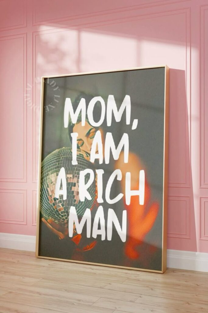 Framed artwork with the text Mom, I am a rich man in pink room with wooden floor.
