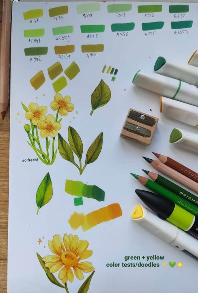 Yellow and green pencil doodles with color swatches, markers, sharpeners, and pencils on a workspace.