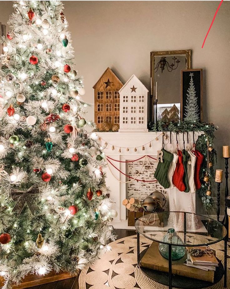 _ Cozy living room with a decorated Christmas tree, stockings on the mantel, and festive holiday decor. | Sky Rye Design Cozy living room with a decorated Christmas tree, stockings on the mantel, and festive holiday decor.