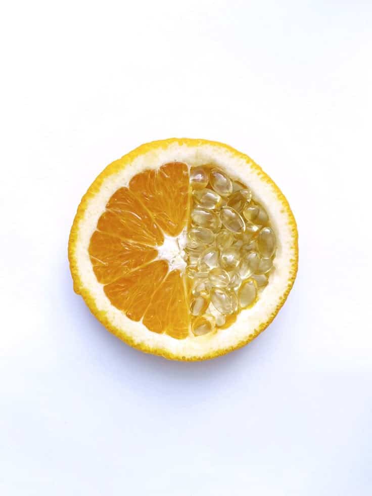 Нутрициология бады зож Half-orange half-gelatin capsules on white background, highlighting a unique blend of natural and synthetic. | Sky Rye Design Half-orange half-gelatin capsules on white background, highlighting a unique blend of natural and synthetic.