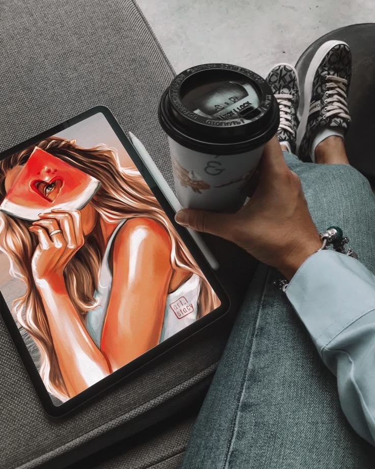 Процесс Person holding coffee cup, viewing colorful art on tablet, wearing jeans and patterned sneakers. Cozy creative moment. | Sky Rye Design Person holding coffee cup, viewing colorful art on tablet, wearing jeans and patterned sneakers. Cozy creative moment.