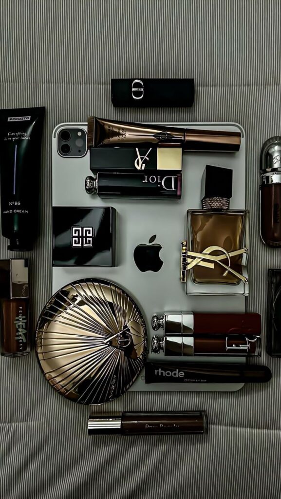 впаива Luxury beauty products and designer items arranged aesthetically on a laptop, highlighting fashion and style essentials. | Sky Rye Design Luxury beauty products and designer items arranged aesthetically on a laptop, highlighting fashion and style essentials.