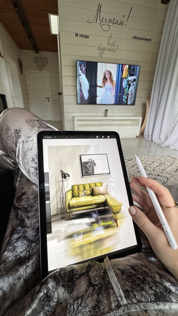 пифуеа Drawing a stylish yellow sofa on a tablet, TV playing in modern living room setting. | Sky Rye Design Drawing a stylish yellow sofa on a tablet, TV playing in modern living room setting.