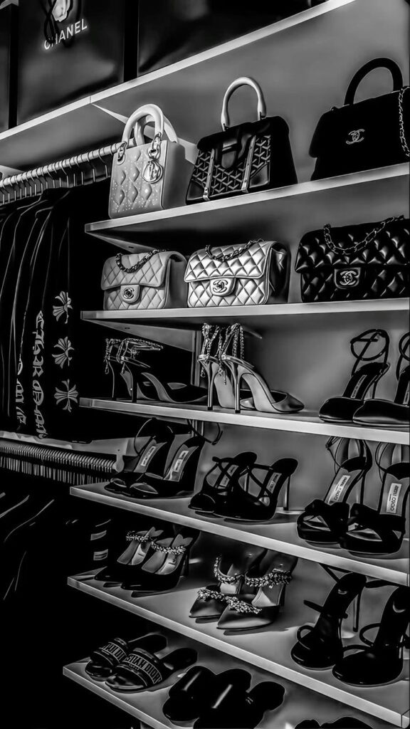 явияв Luxury closet with designer handbags and high heels on shelves in black and white. | Sky Rye Design Luxury closet with designer handbags and high heels on shelves in black and white.