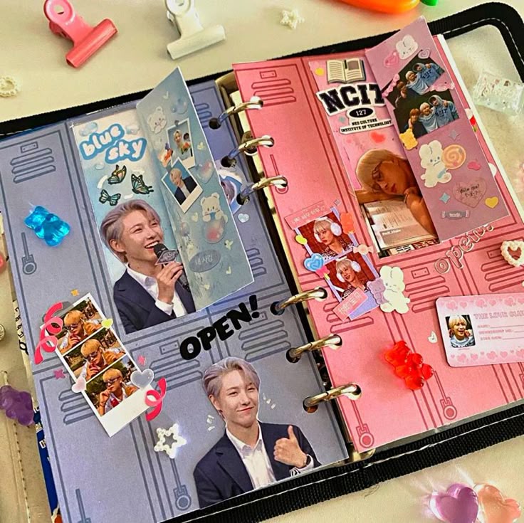 Decorated journal pages with stickers and photos, featuring vibrant designs and playful elements.