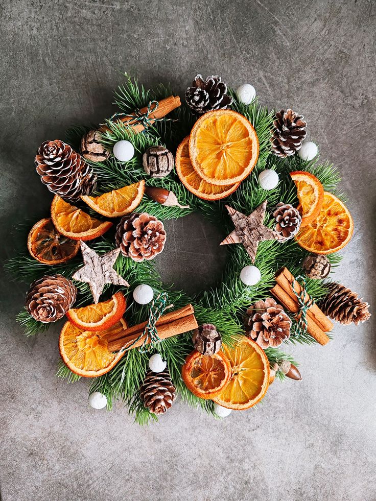 09d1b6905fcee3bd96d73bd496c1e22a Festive Christmas wreath with pinecones, dried orange slices, and cinnamon sticks on a rustic background, perfect for holiday decor. | Sky Rye Design Festive Christmas wreath with pinecones, dried orange slices, and cinnamon sticks on a rustic background, perfect for holiday decor.