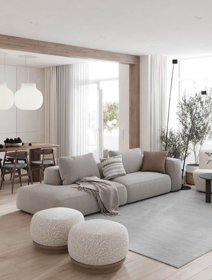 _ 12 Modern living room with a beige sofa, wood accents, dining area, and natural light for a cozy, minimalist design. | Sky Rye Design Modern living room with a beige sofa, wood accents, dining area, and natural light for a cozy, minimalist design.