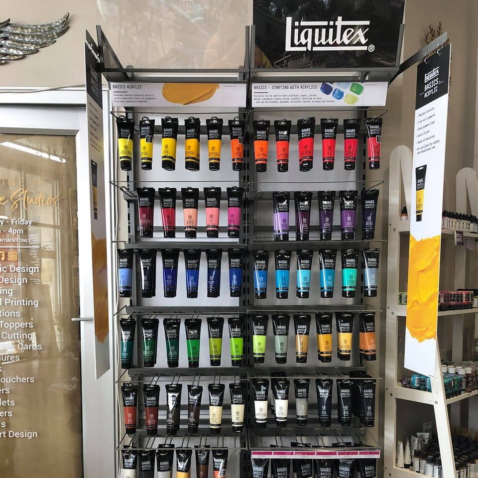 132196841_152639206267776_2154382460705916099_n__91812 Display of Liquitex Basics acrylic paints and paint brushes in a store, showcasing a wide range of vibrant colors. | Sky Rye Design Display of Liquitex Basics acrylic paints and paint brushes in a store, showcasing a wide range of vibrant colors.