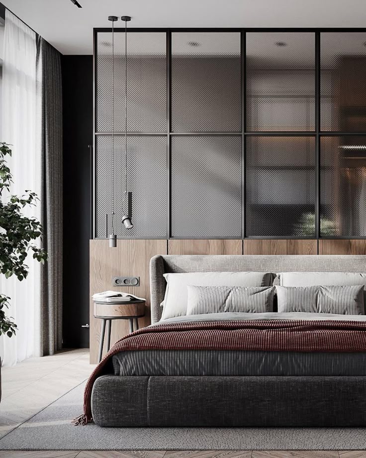 _ 14 Modern bedroom design featuring a gray bed with a textured blanket, stylish pendant lights, and a wood-accented wall with large windows. | Sky Rye Design Modern bedroom design featuring a gray bed with a textured blanket, stylish pendant lights, and a wood-accented wall with large windows.
