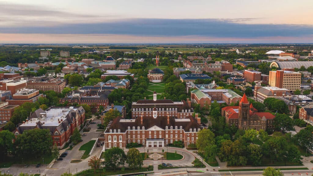 145637_hero Aerial view of the University of Illinois campus in Urbana, showcasing historic buildings, greenery, and a vibrant academic environment. | Sky Rye Design Aerial view of the University of Illinois campus in Urbana, showcasing historic buildings, greenery, and a vibrant academic environment.