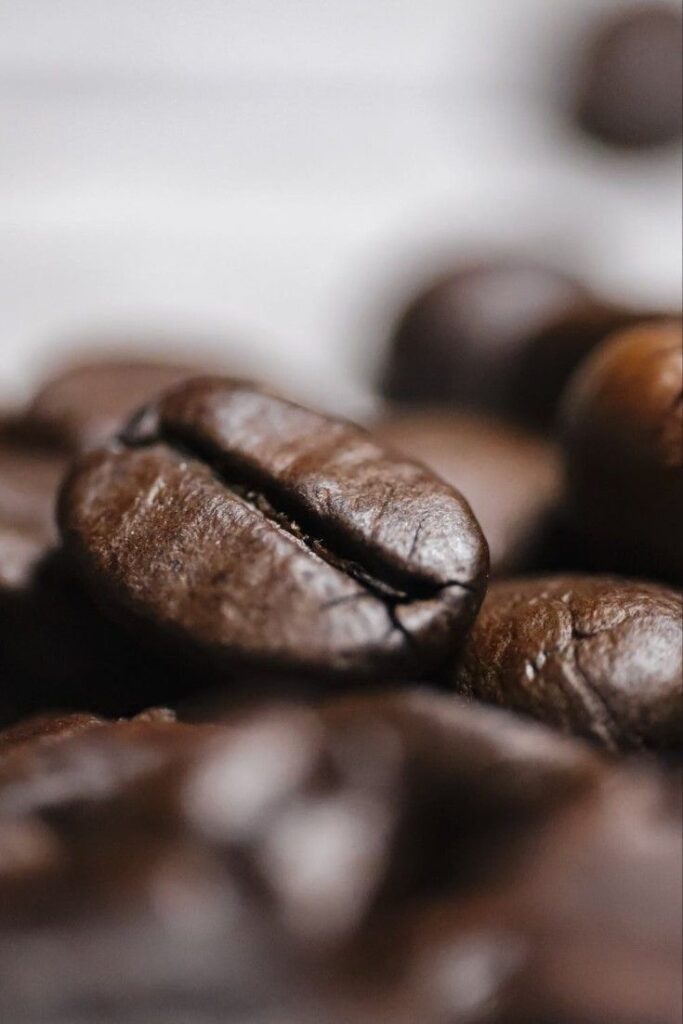 _ 15 Close-up view of roasted coffee beans, showcasing rich texture and color, ideal for coffee enthusiasts and baristas alike. | Sky Rye Design Close-up view of roasted coffee beans, showcasing rich texture and color, ideal for coffee enthusiasts and baristas alike.
