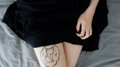 women thigh tattoo placement