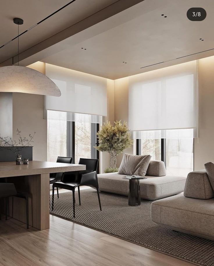 _ 18 Modern living room with minimalistic decor, featuring a cozy sofa, large windows, wooden dining table, and stylish chairs on a textured rug. | Sky Rye Design Modern living room with minimalistic decor, featuring a cozy sofa, large windows, wooden dining table, and stylish chairs on a textured rug.