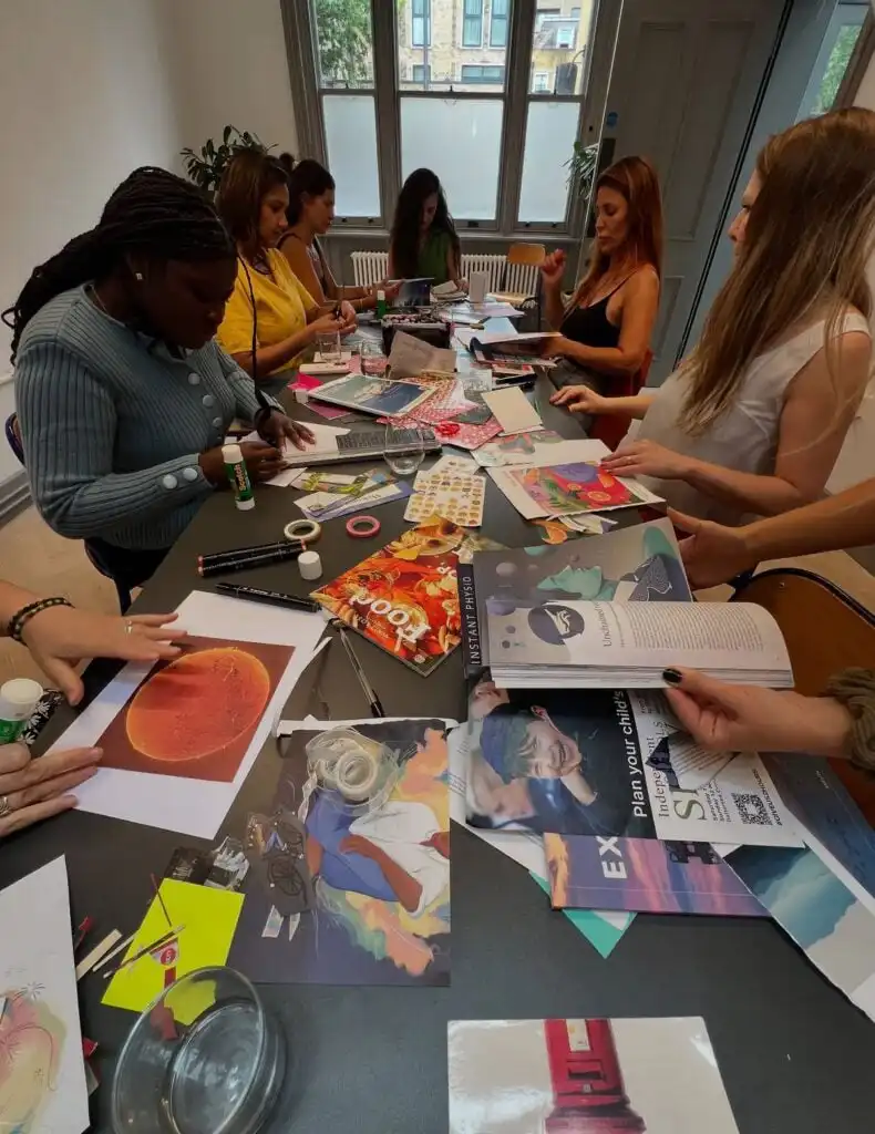 1b440a4ceb19465afaf4872f7a572c09 Women engaging in a collaborative arts and crafts session, creating colorful collages at a table with magazines, scissors, and glue. | Sky Rye Design Women engaging in a collaborative arts and crafts session, creating colorful collages at a table with magazines, scissors, and glue.