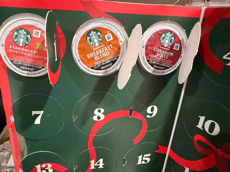 Starbucks K-Cups advent calendar with Peppermint Mocha, Breakfast Blend, and Cinnamon Dolce flavors, perfect for holiday coffee lovers.