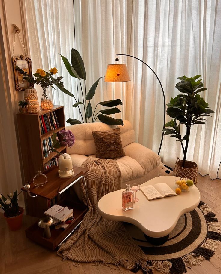 1f792364-73b5-4409-a999-45b785dd7d0c Cozy living room nook with armchair, lamp, plants, bookshelf, and coffee table on a patterned rug. Relaxing ambience with natural light. | Sky Rye Design Cozy living room nook with armchair, lamp, plants, bookshelf, and coffee table on a patterned rug. Relaxing ambience with natural light.