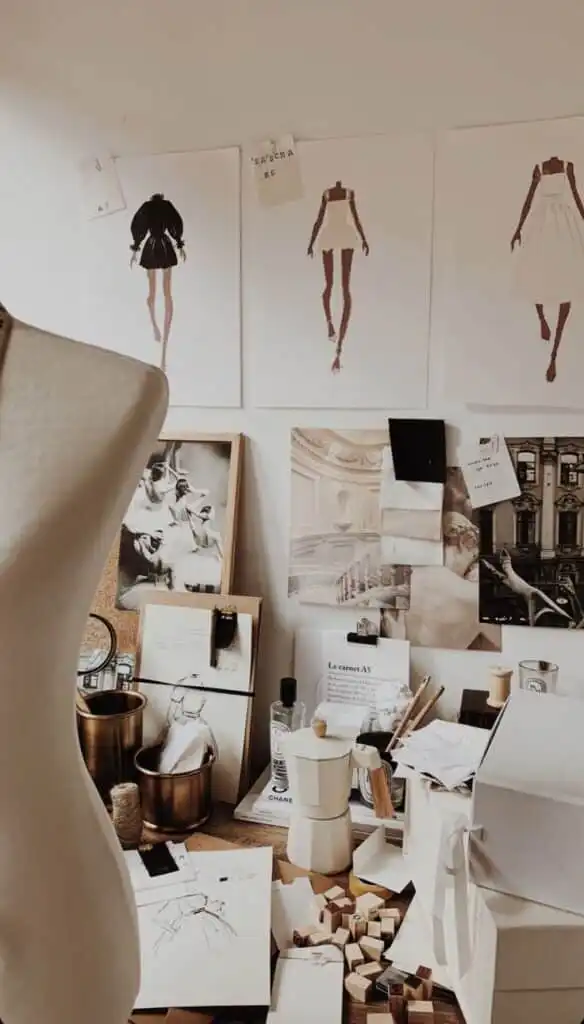 _ 2 Fashion design workspace featuring sketches, a dress form, and various artistic tools, creating an inspiring creative environment. | Sky Rye Design Fashion design workspace featuring sketches, a dress form, and various artistic tools, creating an inspiring creative environment.