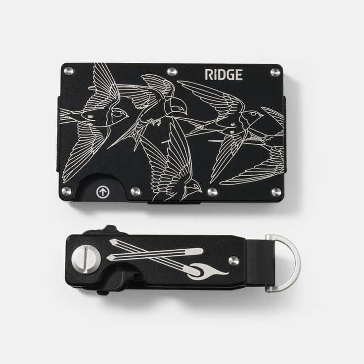 Stylish black Ridge wallet and key holder featuring engraved flying birds design, perfect for modern minimalist accessory enthusiasts.