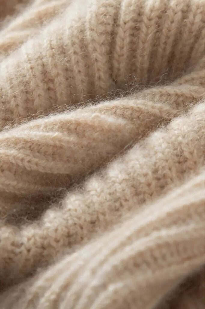 _ - 2025-12-04T131538229 Close-up of soft beige wool fabric texture with knitted pattern, perfect for cozy winter clothing or home decor. | Sky Rye Design Close-up of soft beige wool fabric texture with knitted pattern, perfect for cozy winter clothing or home decor.