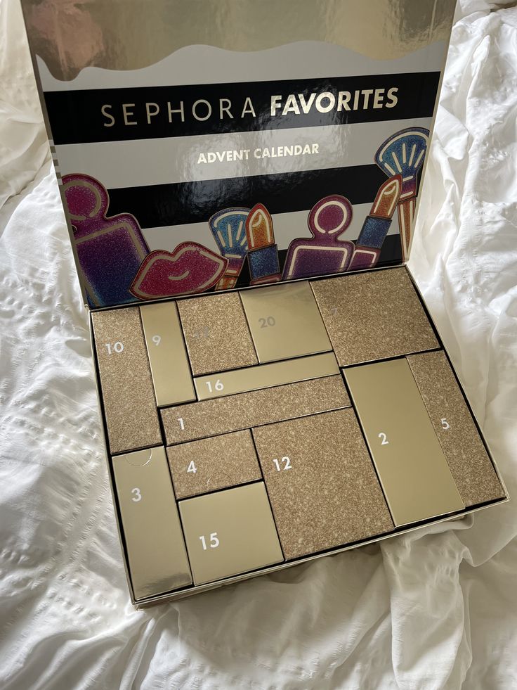 Sephora Favorites Advent Calendar with numbered gold boxes, perfect for beauty enthusiasts. Discover daily surprises in stylish packaging.