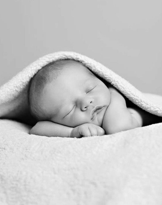 _ - 2025-12-12T124059707 Sleeping newborn baby wrapped in a cozy blanket, black and white photo. Peaceful, serene, and adorable infant resting quietly. | Sky Rye Design Sleeping newborn baby wrapped in a cozy blanket, black and white photo. Peaceful, serene, and adorable infant resting quietly.