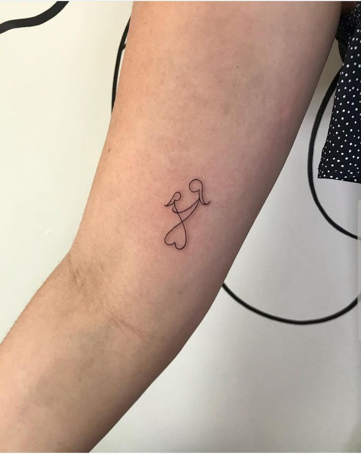 _ - 2025-12-12T132611764 Minimalist line art tattoo of two figures with heart shapes on an inner arm, symbolizing love and connection. | Sky Rye Design Minimalist line art tattoo of two figures with heart shapes on an inner arm, symbolizing love and connection.