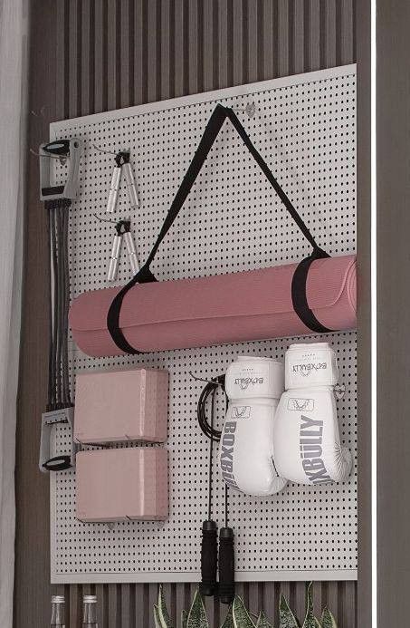_ - 2025-12-16T231357978 Home gym pegboard with pink yoga mat, blocks, boxing gloves, jump rope, and resistance bands neatly organized. | Sky Rye Design Home gym pegboard with pink yoga mat, blocks, boxing gloves, jump rope, and resistance bands neatly organized.