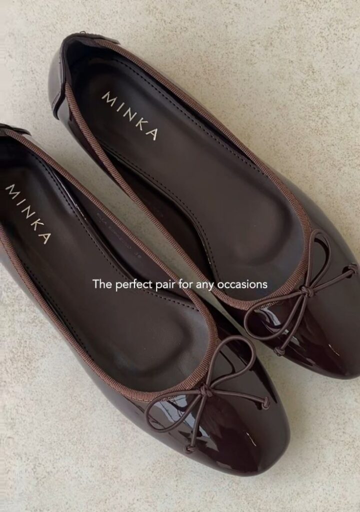 _ - 2025-12-28T124304147 Elegant dark brown ballet flats with bows, perfect for any occasion. Stylish and comfortable footwear by Minka on a light background. | Sky Rye Design Elegant dark brown ballet flats with bows, perfect for any occasion. Stylish and comfortable footwear by Minka on a light background.