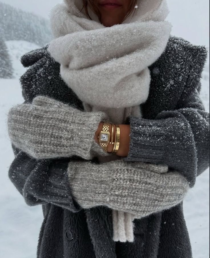 _ - 2025-12-28T133719156 Cozy winter fashion: Woman in wool coat, scarf, mittens, and gold watch amidst snowy landscape, showcasing chic cold-weather style. | Sky Rye Design Cozy winter fashion: Woman in wool coat, scarf, mittens, and gold watch amidst snowy landscape, showcasing chic cold-weather style.