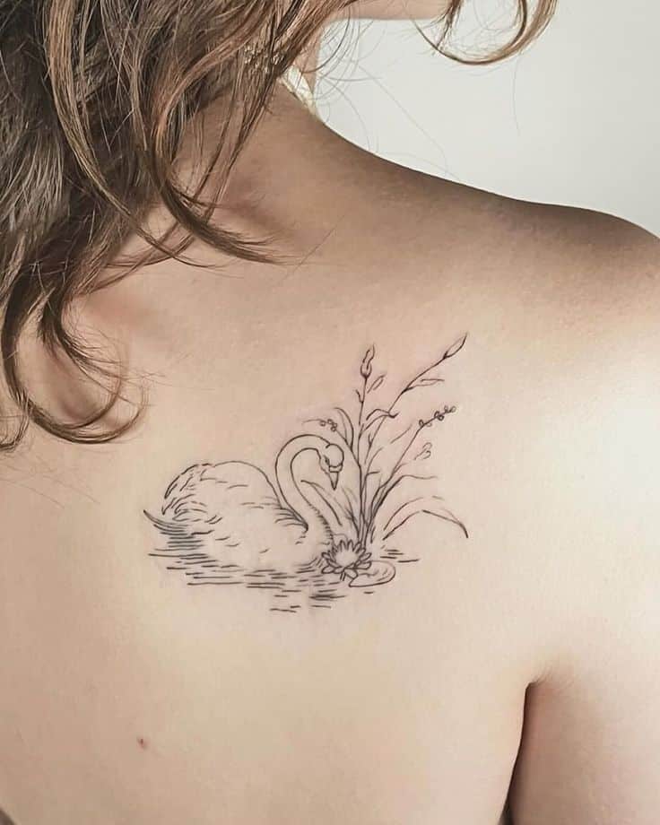 _ - 2025-12-28T163440100 Delicate line art tattoo of a swan with flowers on a person's upper back, showcasing elegant and minimalistic design. | Sky Rye Design Delicate line art tattoo of a swan with flowers on a person's upper back, showcasing elegant and minimalistic design.