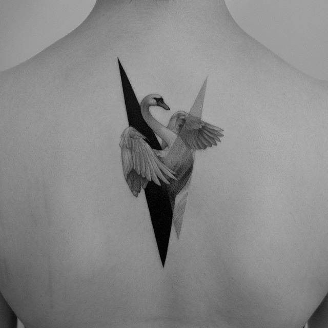 _ - 2025-12-28T164846151 Minimalist swan tattoo on back featuring geometric elements, showcasing elegant and modern body art design in black and white. | Sky Rye Design Minimalist swan tattoo on back featuring geometric elements, showcasing elegant and modern body art design in black and white.