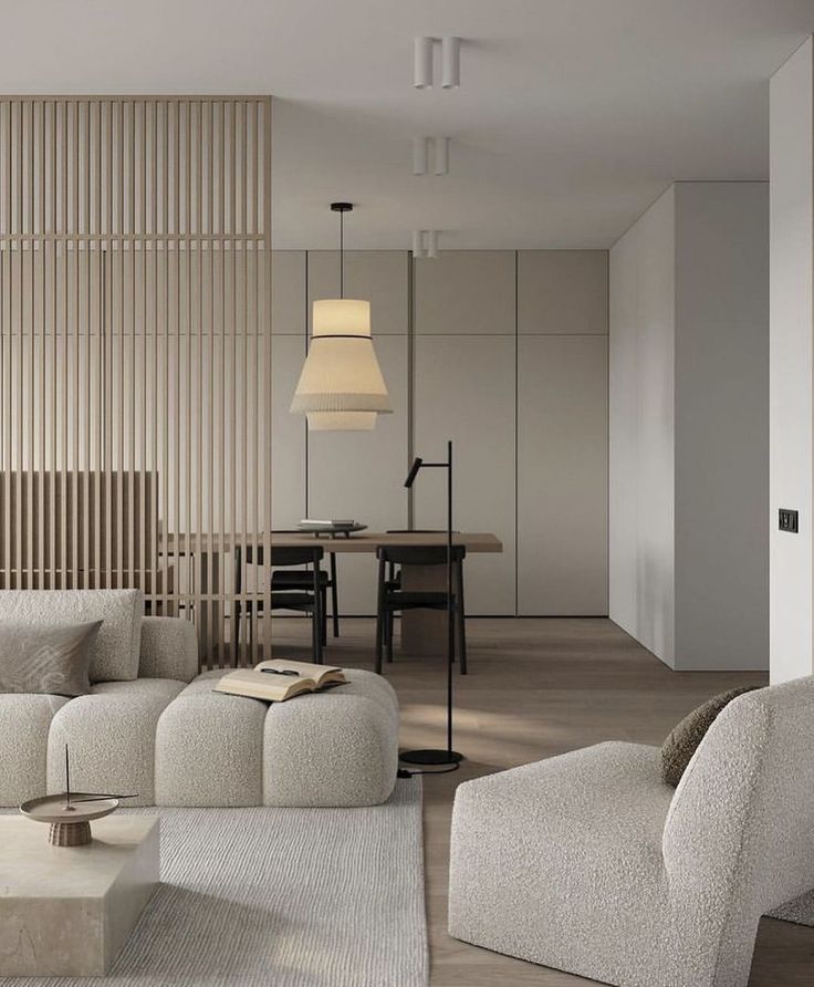_ 25 Modern minimalist living room with neutral tones, featuring a cozy sofa, open book, floor lamp, and wooden decor accents. | Sky Rye Design Modern minimalist living room with neutral tones, featuring a cozy sofa, open book, floor lamp, and wooden decor accents.