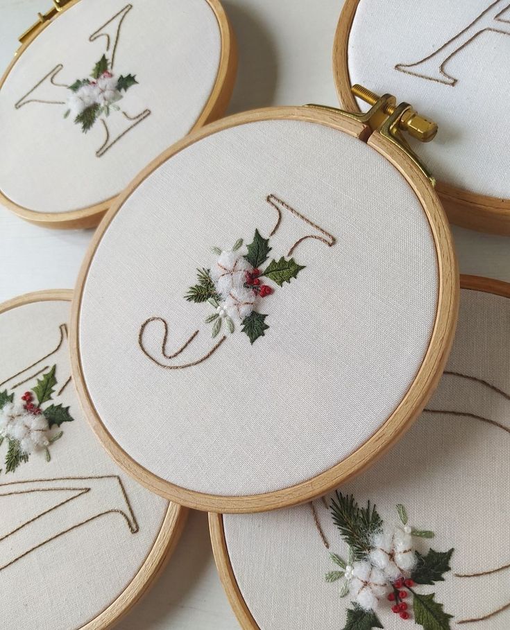 _ 27 Embroidery hoops with elegant monograms and festive floral designs, perfect for holiday decor or personalized gifts. | Sky Rye Design Embroidery hoops with elegant monograms and festive floral designs, perfect for holiday decor or personalized gifts.