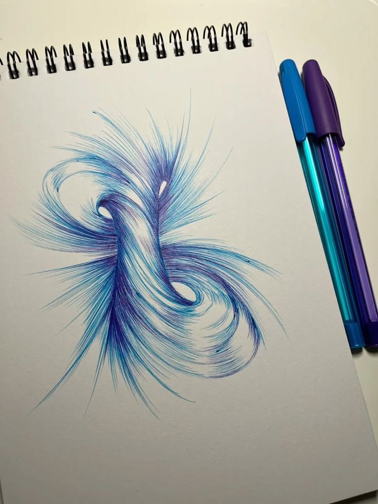 Abstract blue pen art on sketchpad with vibrant swirling patterns, accompanied by three colorful pens. Creative drawing concept. Drawing for Relaxation