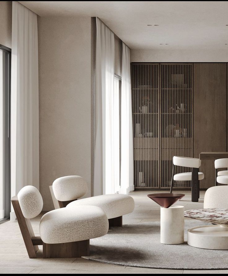 Modern living room with stylish beige chairs, white curtains, and wooden panels. Minimalist decor with soft lighting and neutral tones.