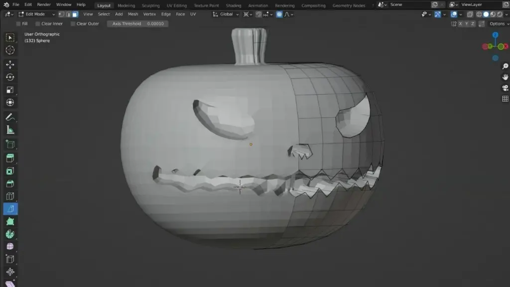 3D modeling software showing a pumpkin design with a carved face, displayed in wireframe view.