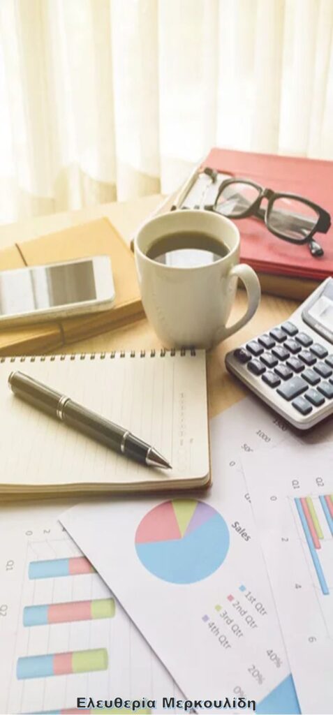 _ 4 Office desk with coffee, calculator, charts, notebook, pen, and glasses, perfect for productivity and business analysis concepts. | Sky Rye Design Office desk with coffee, calculator, charts, notebook, pen, and glasses, perfect for productivity and business analysis concepts.