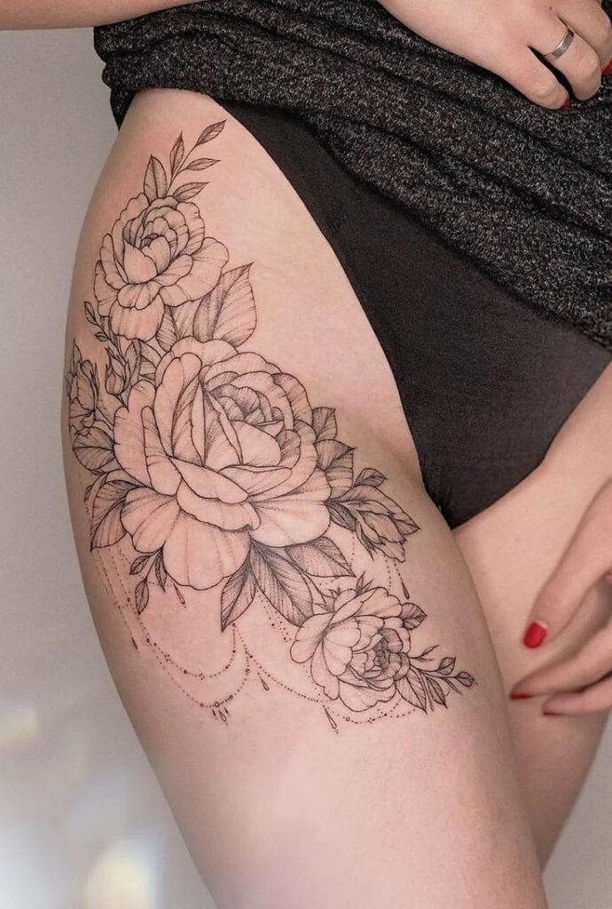 _ 5 Floral thigh tattoo with detailed roses and leaves, showcasing intricate line work on skin for a feminine and artistic design. | Sky Rye Design Floral thigh tattoo with detailed roses and leaves, showcasing intricate line work on skin for a feminine and artistic design.