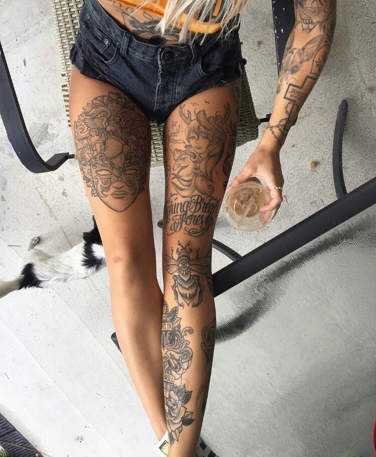 _ 5 Tattooed person holding a drink, wearing shorts, showcasing intricate leg tattoos while sitting outdoors on a chair. | Sky Rye Design Tattooed person holding a drink, wearing shorts, showcasing intricate leg tattoos while sitting outdoors on a chair.