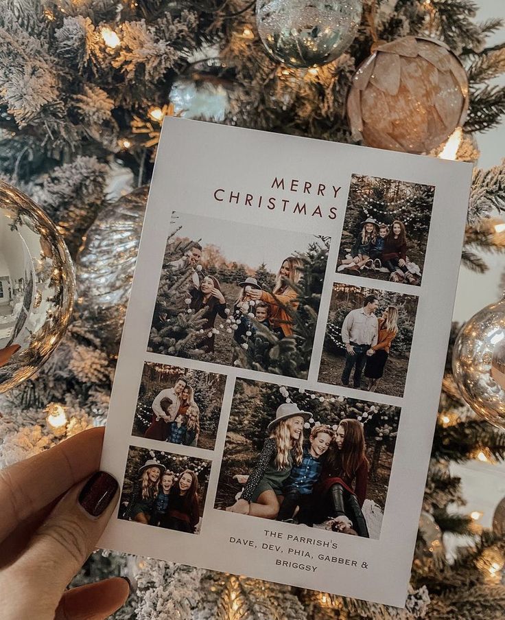54 Insanely Cute Christmas Card Ideas - By Sophia Lee Hand holding a Christmas card with family photos in front of a decorated tree, featuring festive ornaments and warm holiday greetings. | Sky Rye Design Hand holding a Christmas card with family photos in front of a decorated tree, featuring festive ornaments and warm holiday greetings.