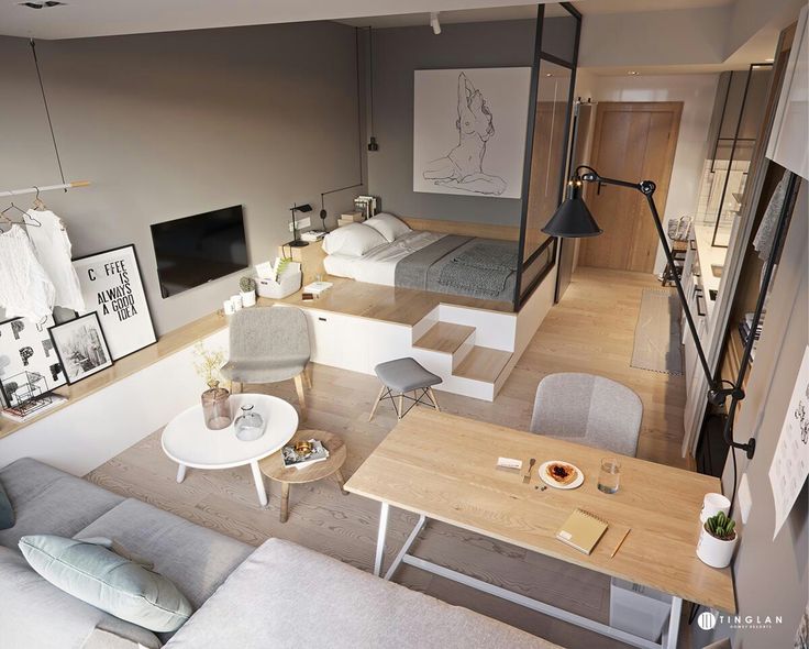 Modern studio apartment with cozy bed, stylish decor, dining table, and neutral tones. Perfect small-space living inspiration.